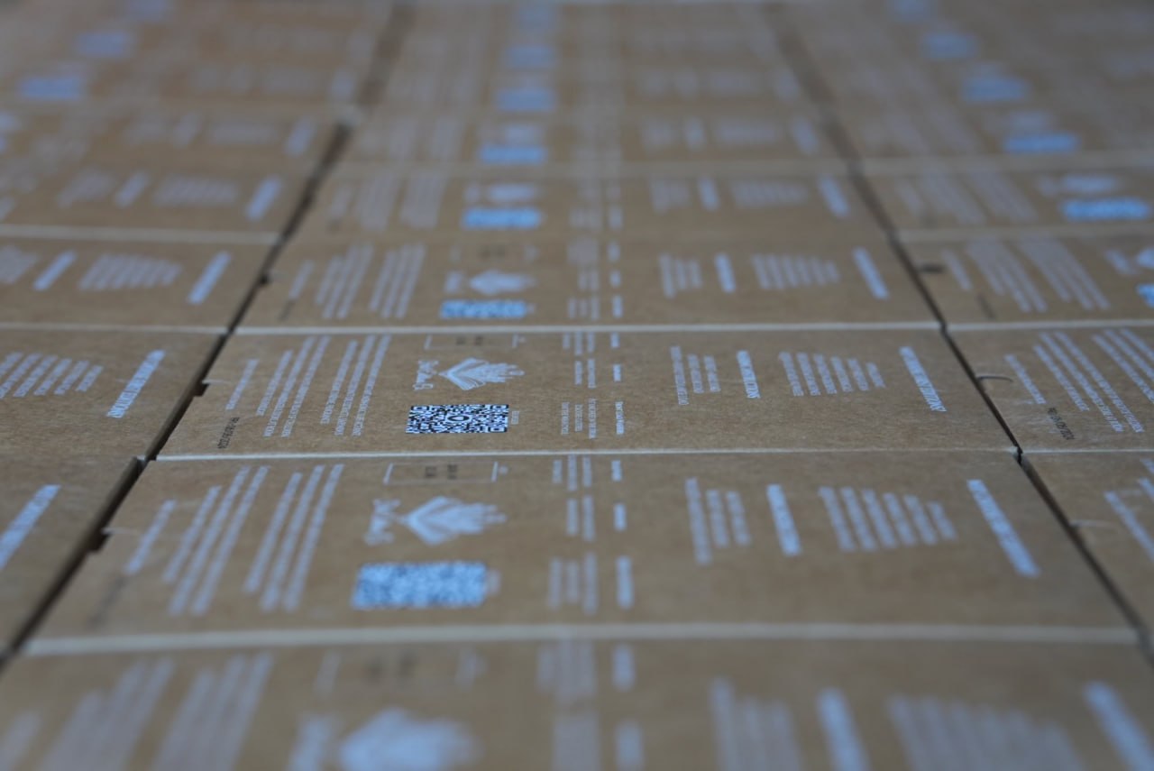 Rows of First Editions wholesale shipping boxes prepared for retail orders